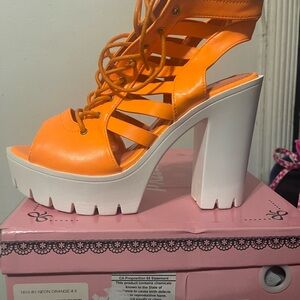 Brand new orange lace up high heel sandals